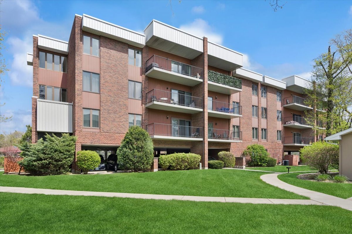 6545 Main Street, Unit 407 Downers Grove, IL 60516 - Photo 18 of 18 a front view of a building