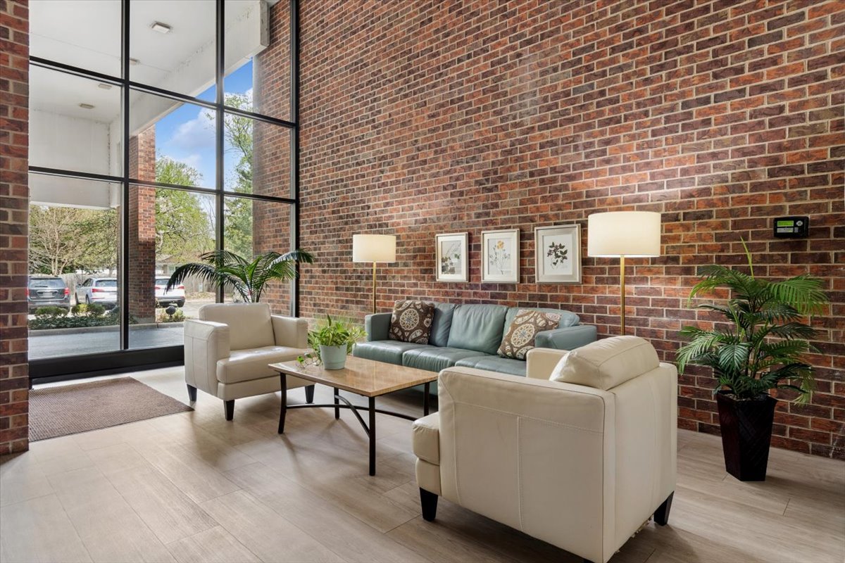 6545 Main Street, Unit 407 Downers Grove, IL 60516 - Photo 2 of 18 a living room with furniture and wooden floor