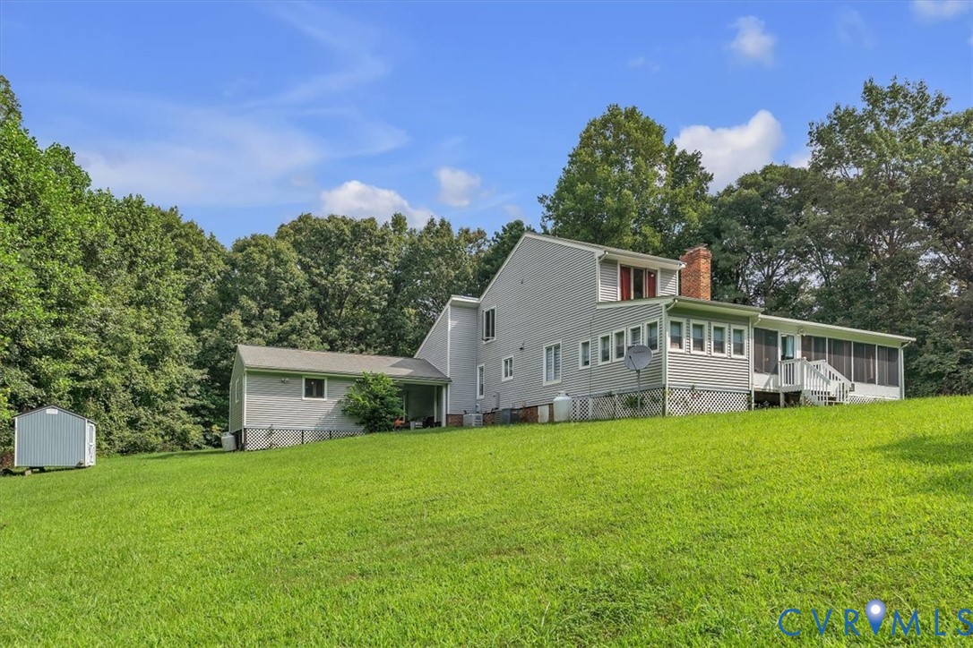 4037 Quinton Road Quinton, VA 23141 - Photo 39 of 39 Rear view of property with a sunroom, a shed, a ch
