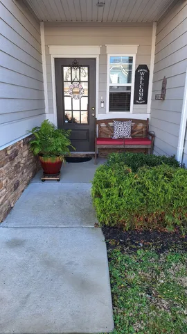 a view of front door of house with outdoor space