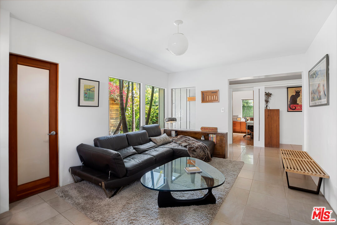 14840 Sunset Boulevard Pacific Palisades, CA 90272 - Photo 13 of 33 a living room with furniture and a window