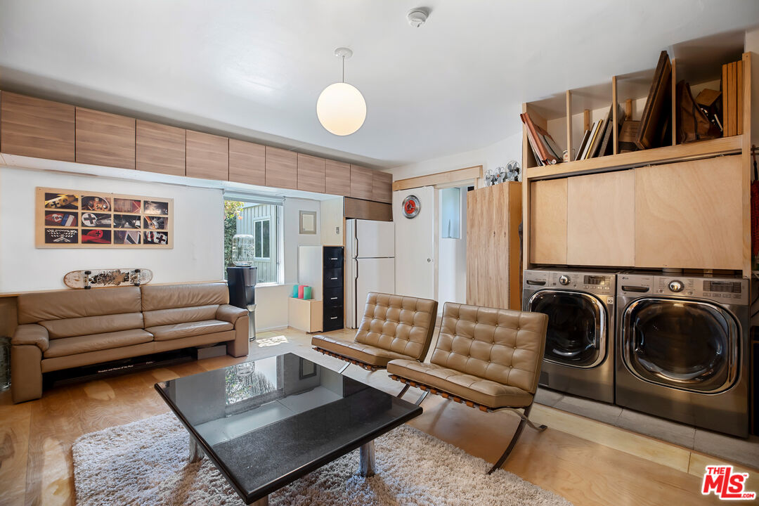 14840 Sunset Boulevard Pacific Palisades, CA 90272 - Photo 15 of 33 a living room with furniture and a rug