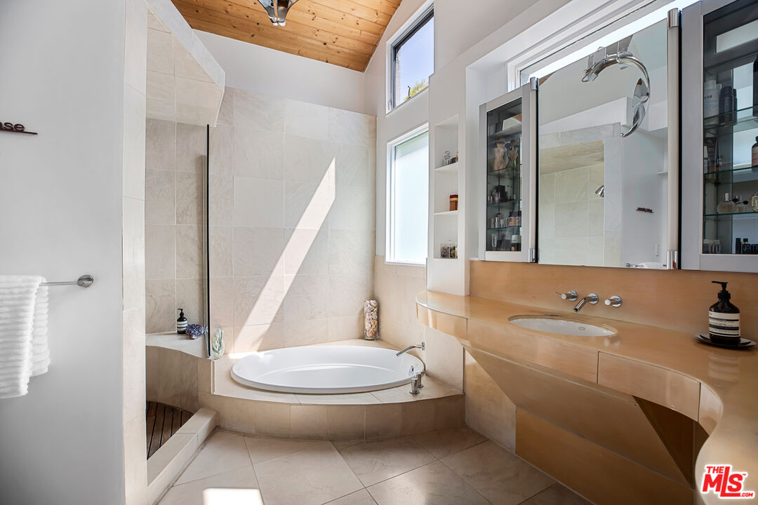 14840 Sunset Boulevard Pacific Palisades, CA 90272 - Photo 18 of 33 a bathroom with a sink toilet and shower