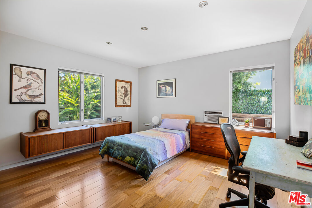 14840 Sunset Boulevard Pacific Palisades, CA 90272 - Photo 20 of 33 a bedroom with furniture and a window
