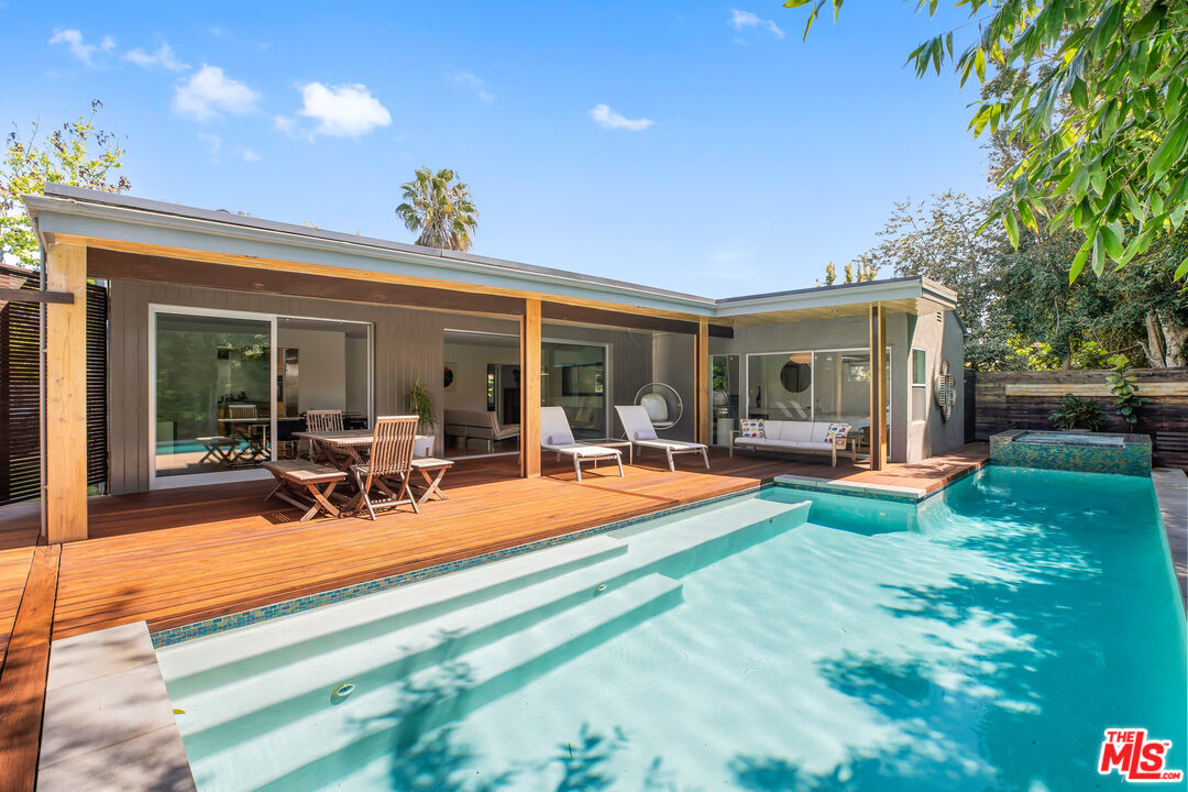 14840 Sunset Boulevard Pacific Palisades, CA 90272 - Photo 24 of 33 a view of a house with swimming pool and porch with furniture