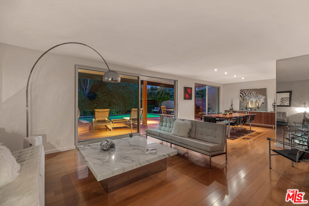 14840 Sunset Boulevard Pacific Palisades, CA 90272 - Photo 28 of 33 a living room with furniture and a flat screen tv