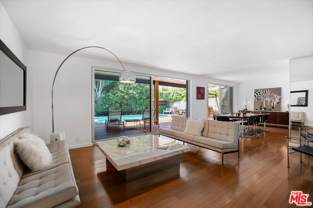 14840 Sunset Boulevard Pacific Palisades, CA 90272 - Photo 6 of 33 a living room with furniture and a large window