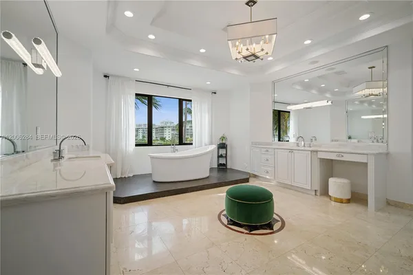 a bathroom with a toilet a sink and glass door