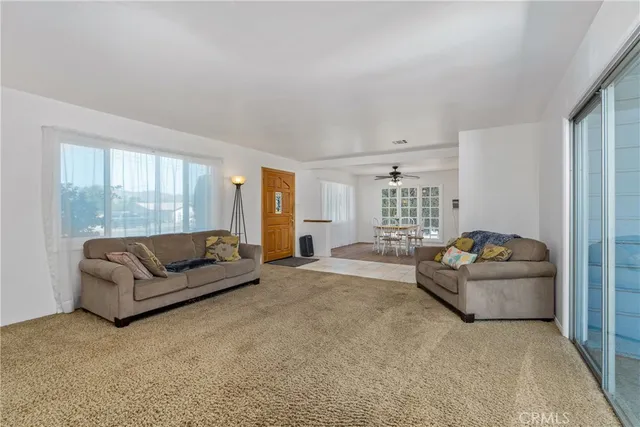 a dining room with wooden floor and a window