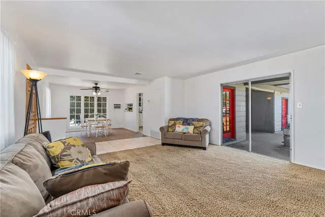 a view of a dining room with furniture and a window