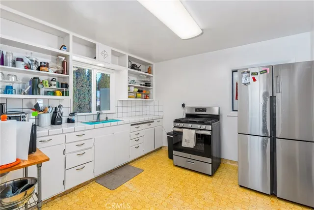 a view of a bedroom with workspace and bedroom