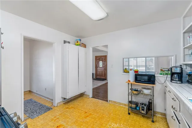 a room with a chair and gym equipment