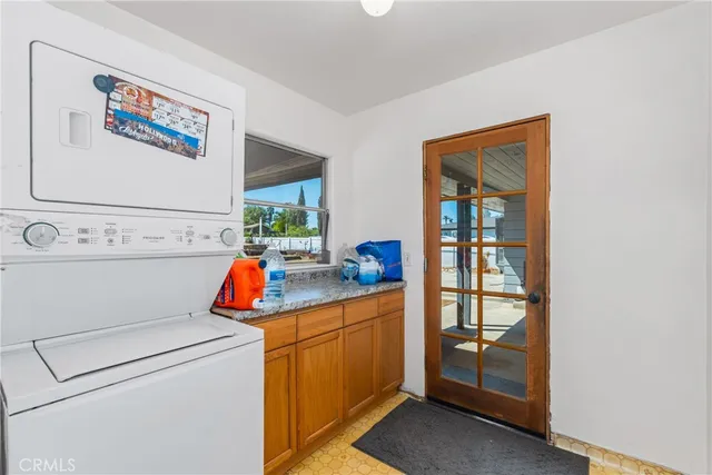 a view of a livingroom with a chandelier fan