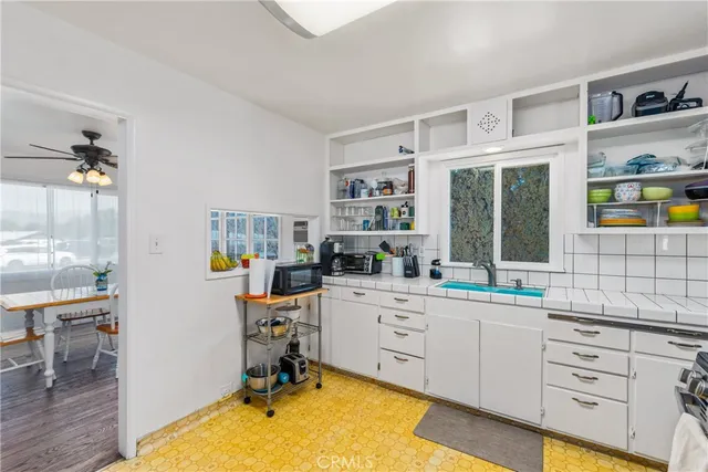 a view of a chandelier fan and closet in a room