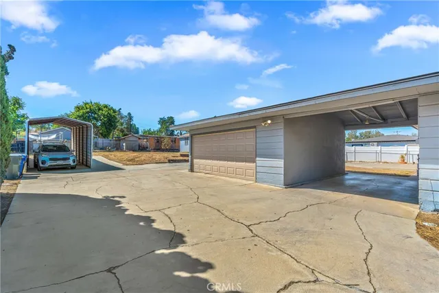 a backyard of a house with yard and garage
