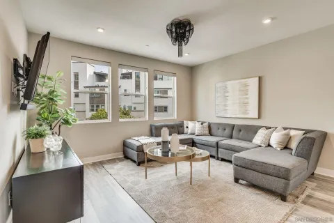 a living room with furniture and a large window