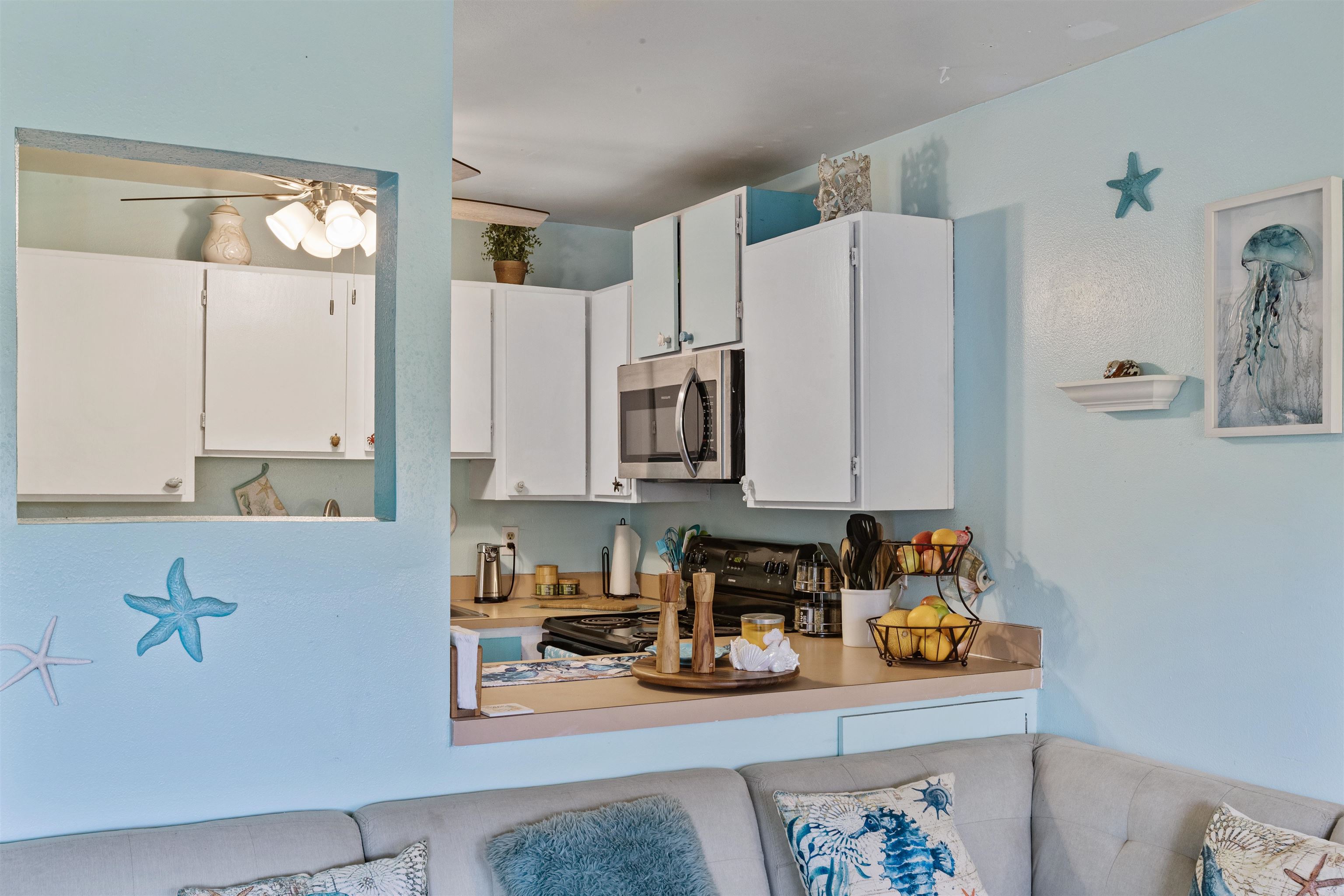 3740 Lower Honoapiilani Road, Unit F306 Lahaina, HI 96761 - Photo 13 of 30 a kitchen with stainless steel appliances a refrigerator and a sink