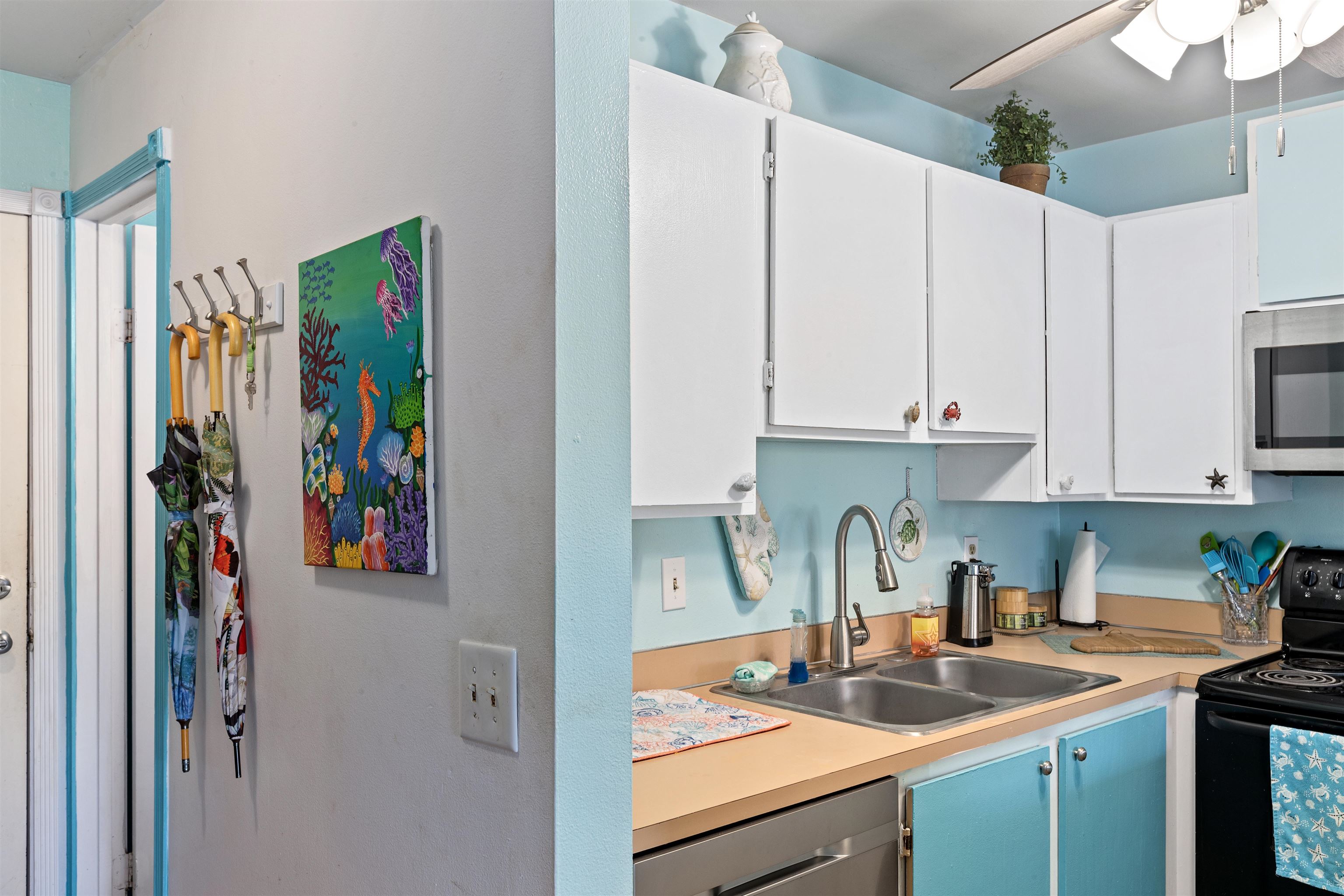 3740 Lower Honoapiilani Road, Unit F306 Lahaina, HI 96761 - Photo 14 of 30 a kitchen with stainless steel appliances granite countertop a refrigerator and a sink