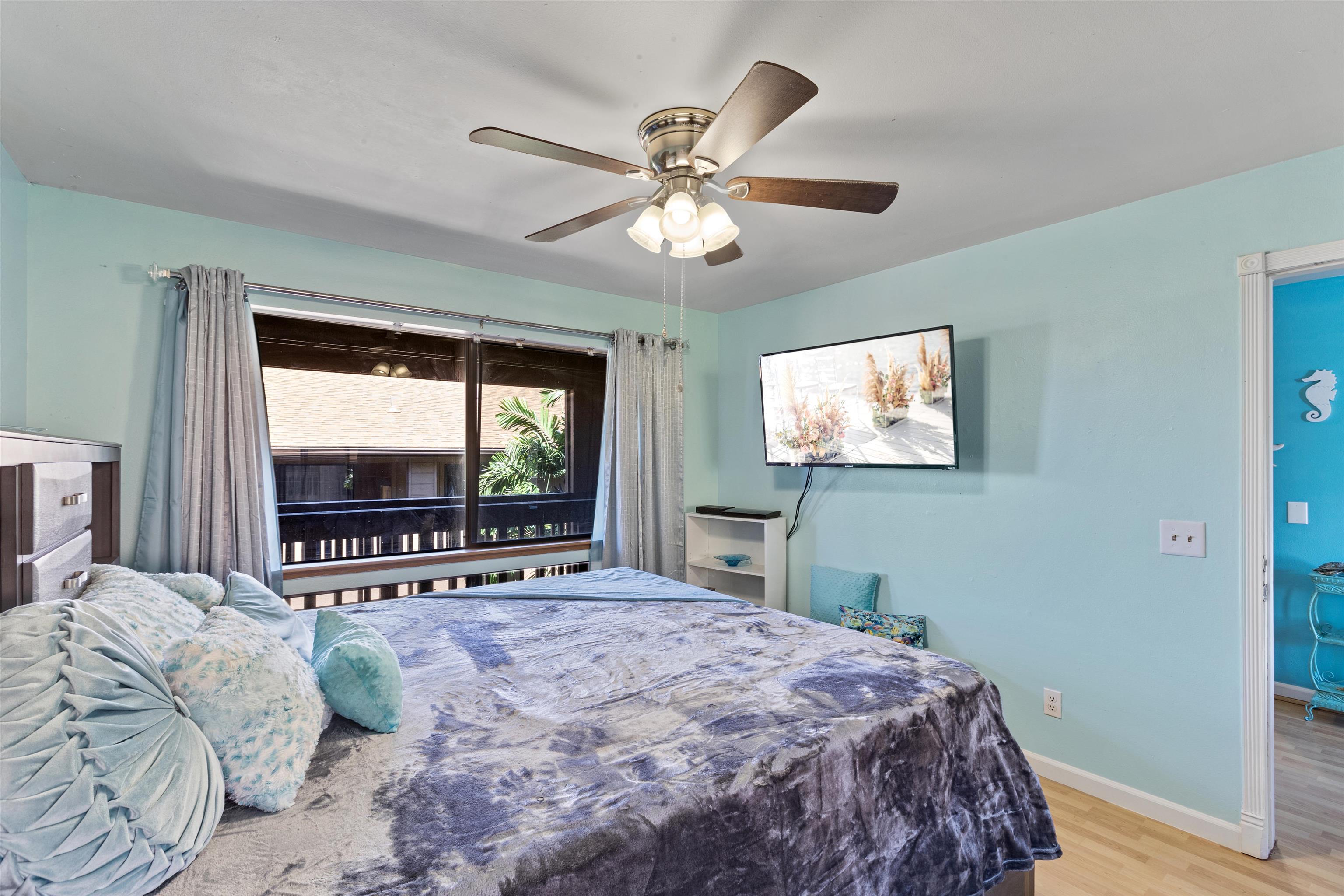 3740 Lower Honoapiilani Road, Unit F306 Lahaina, HI 96761 - Photo 16 of 30 a bedroom with a large bed and a window