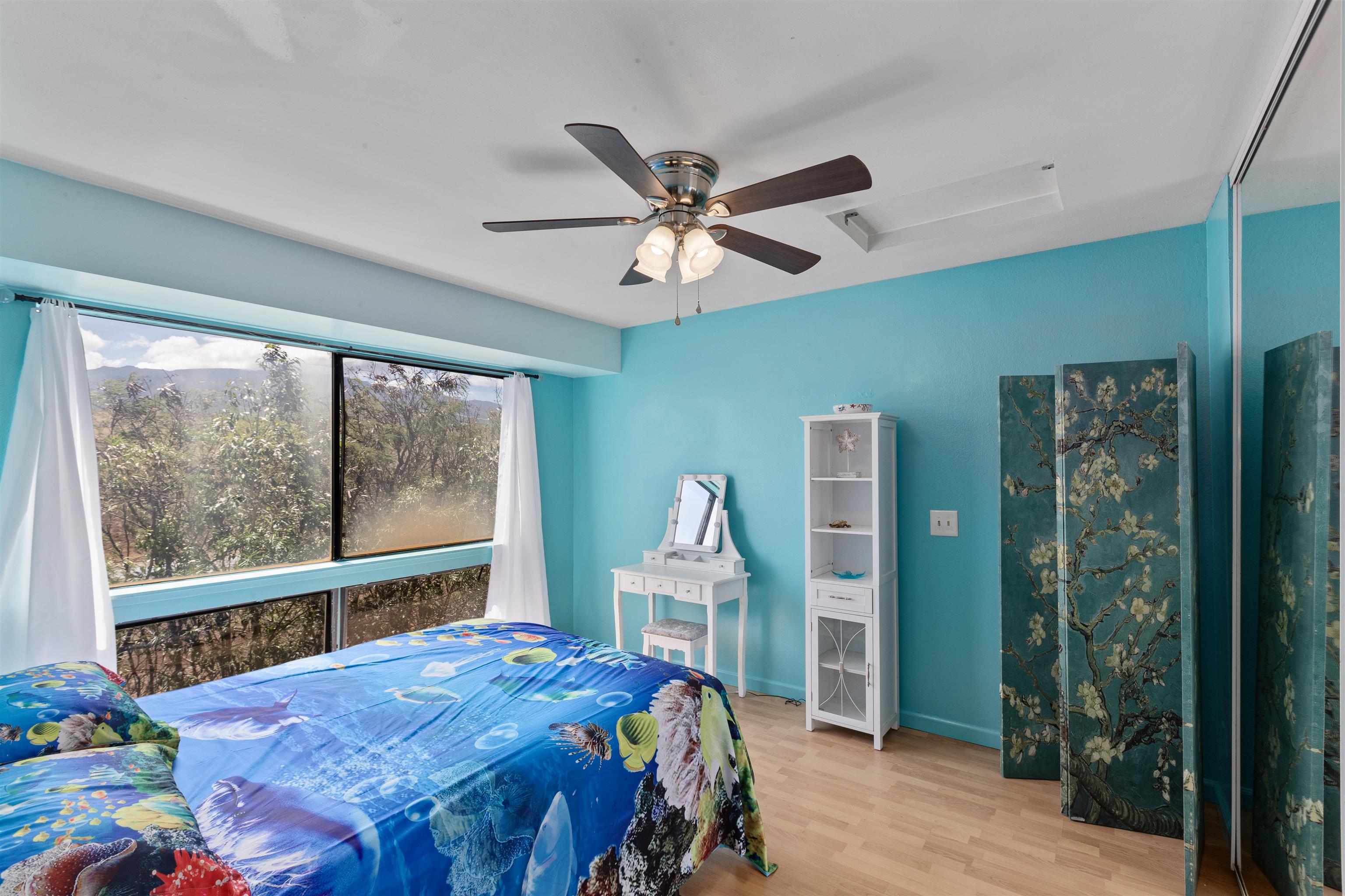 3740 Lower Honoapiilani Road, Unit F306 Lahaina, HI 96761 - Photo 18 of 30 a bedroom with a bed and a large window