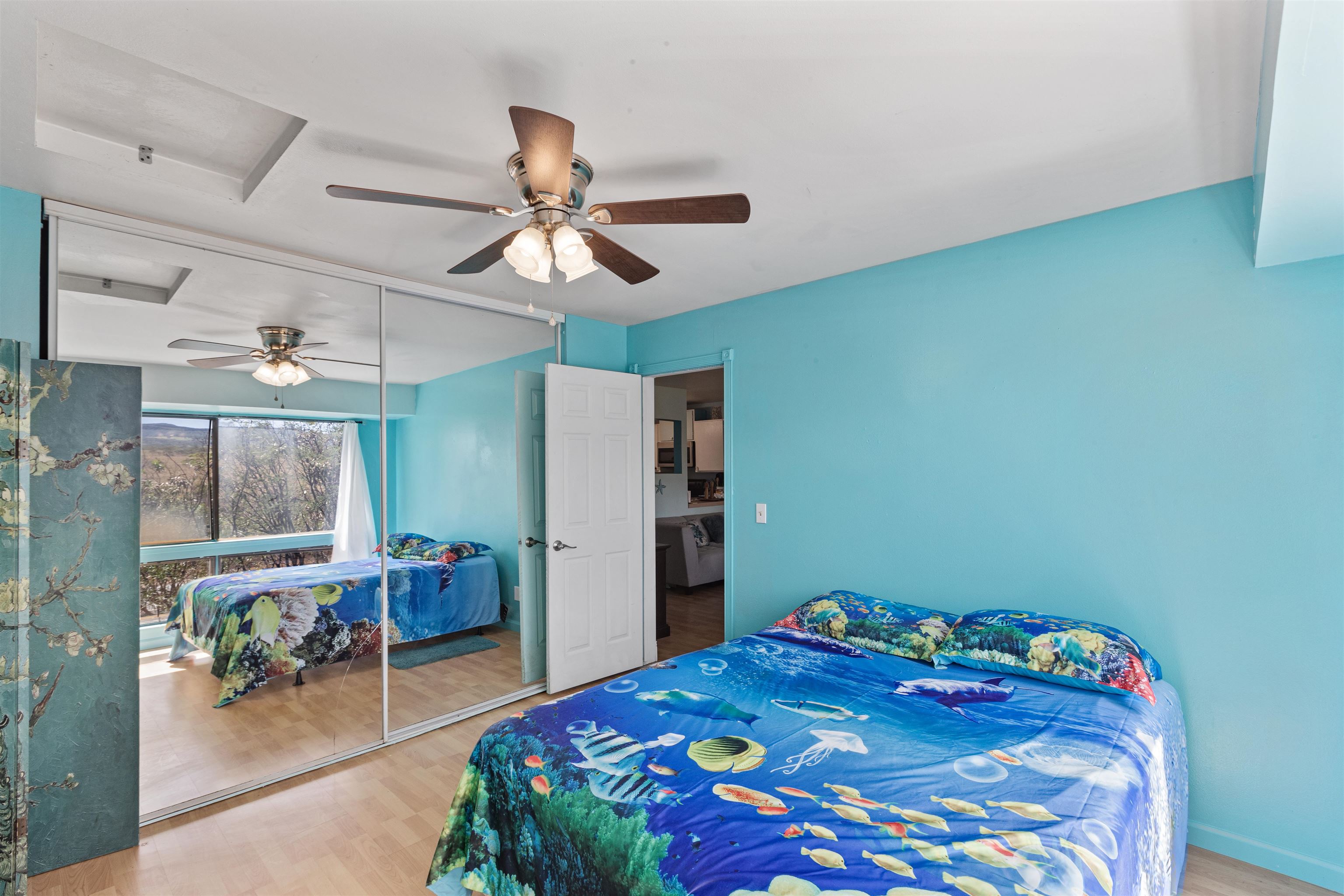 3740 Lower Honoapiilani Road, Unit F306 Lahaina, HI 96761 - Photo 19 of 30 a bedroom with a bed a desk and chair