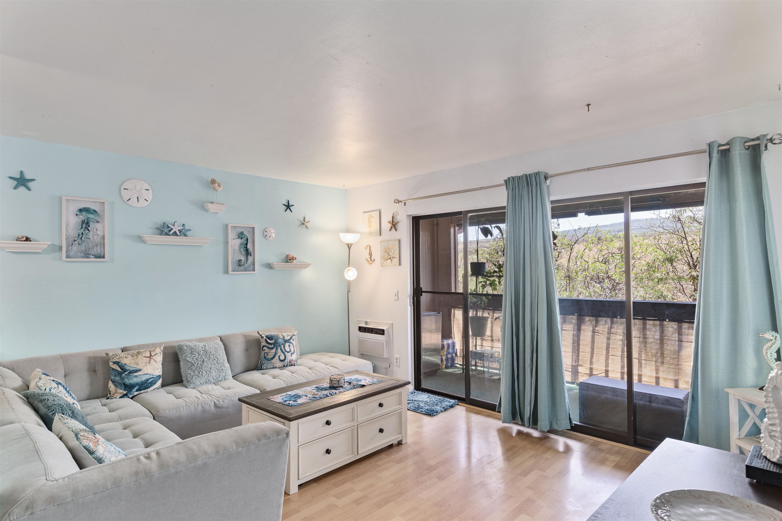 3740 Lower Honoapiilani Road, Unit F306 Lahaina, HI 96761 - Photo 2 of 30 a living room with furniture and a large window
