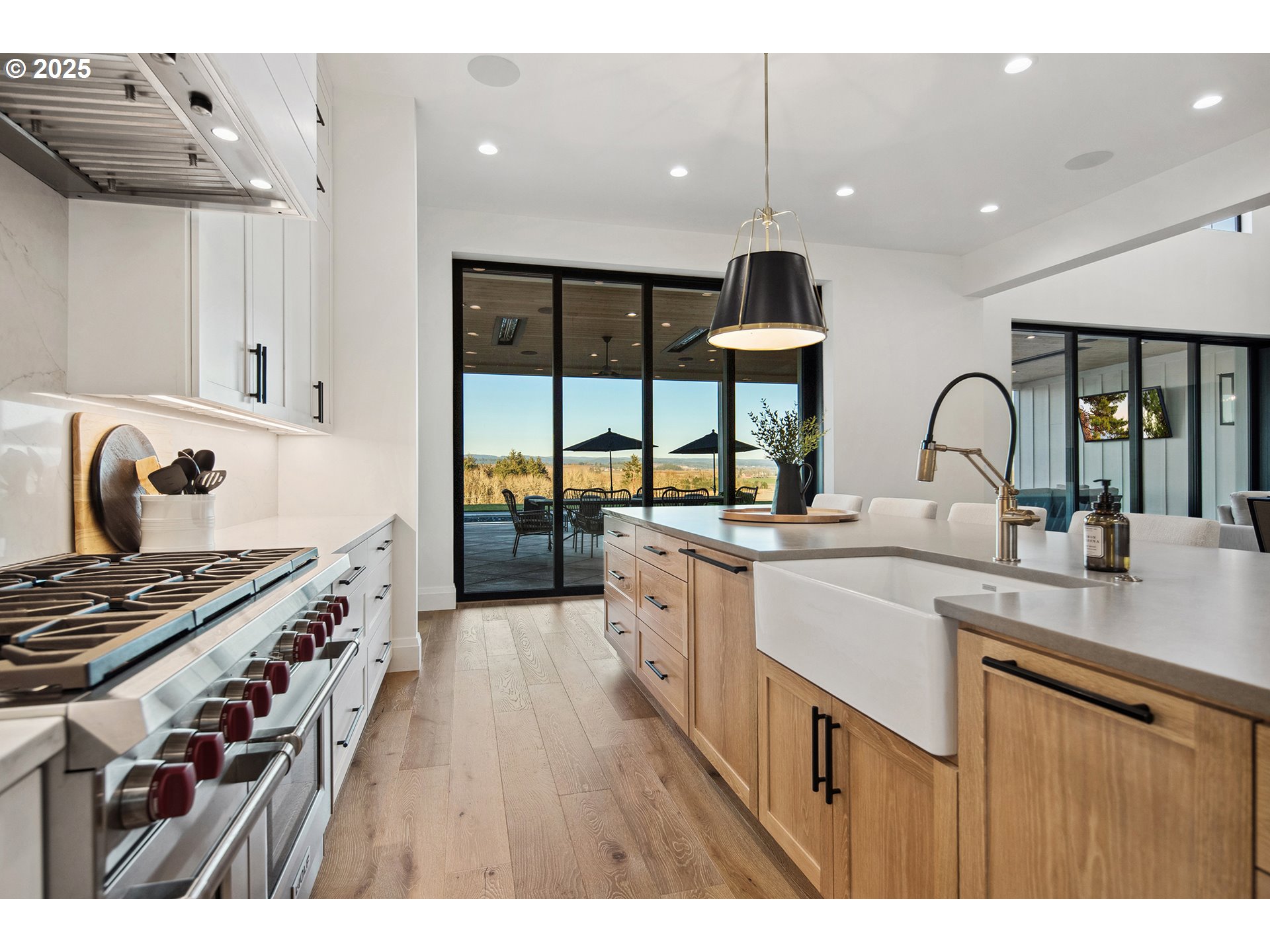 48493 Northwest Hillside Road Forest Grove, OR 97116 - Photo 13 of 48 a kitchen with stainless steel appliances a sink stove and cabinets