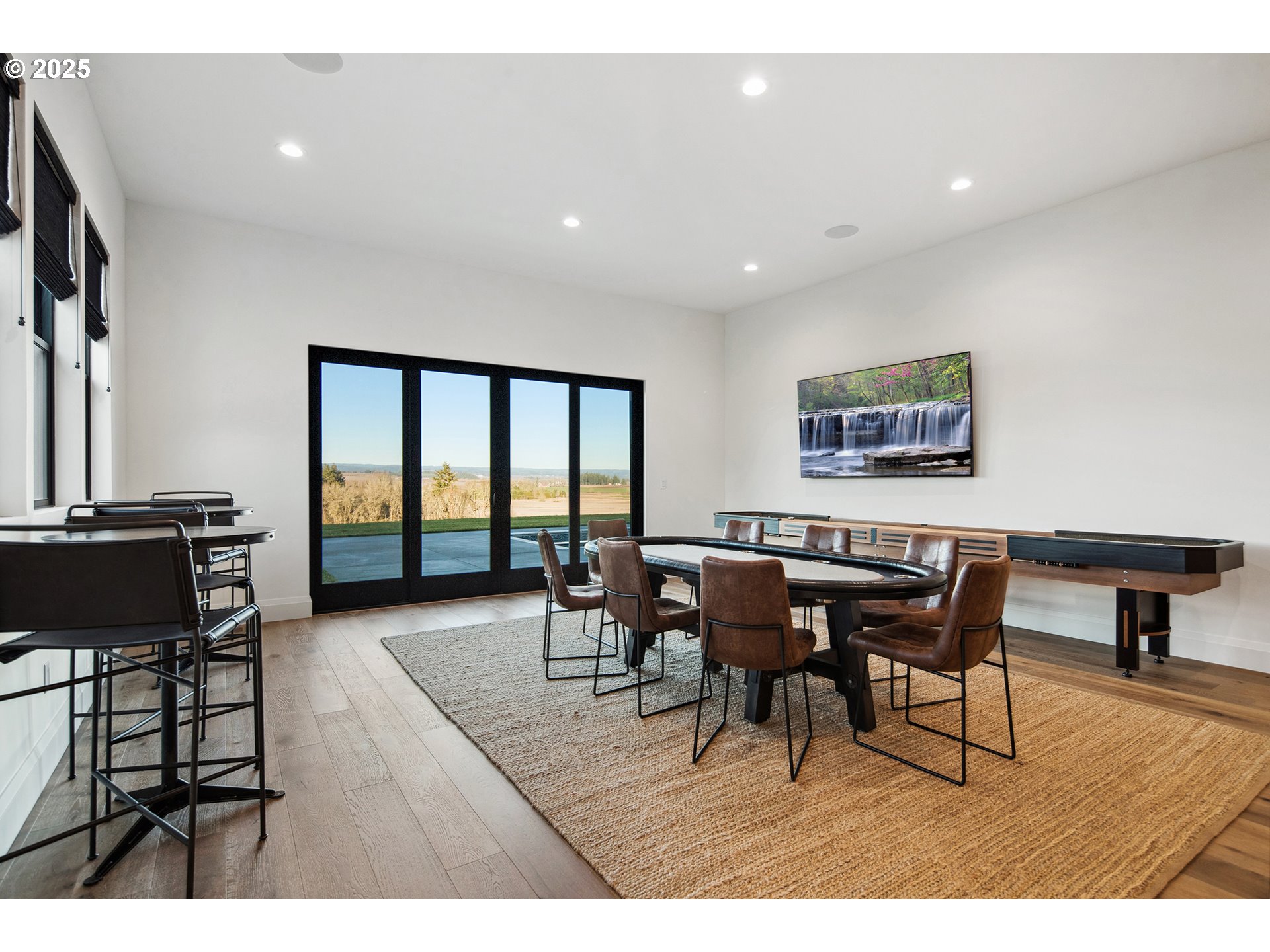 48493 Northwest Hillside Road Forest Grove, OR 97116 - Photo 35 of 48 a dining room with furniture a rug and a flat screen tv