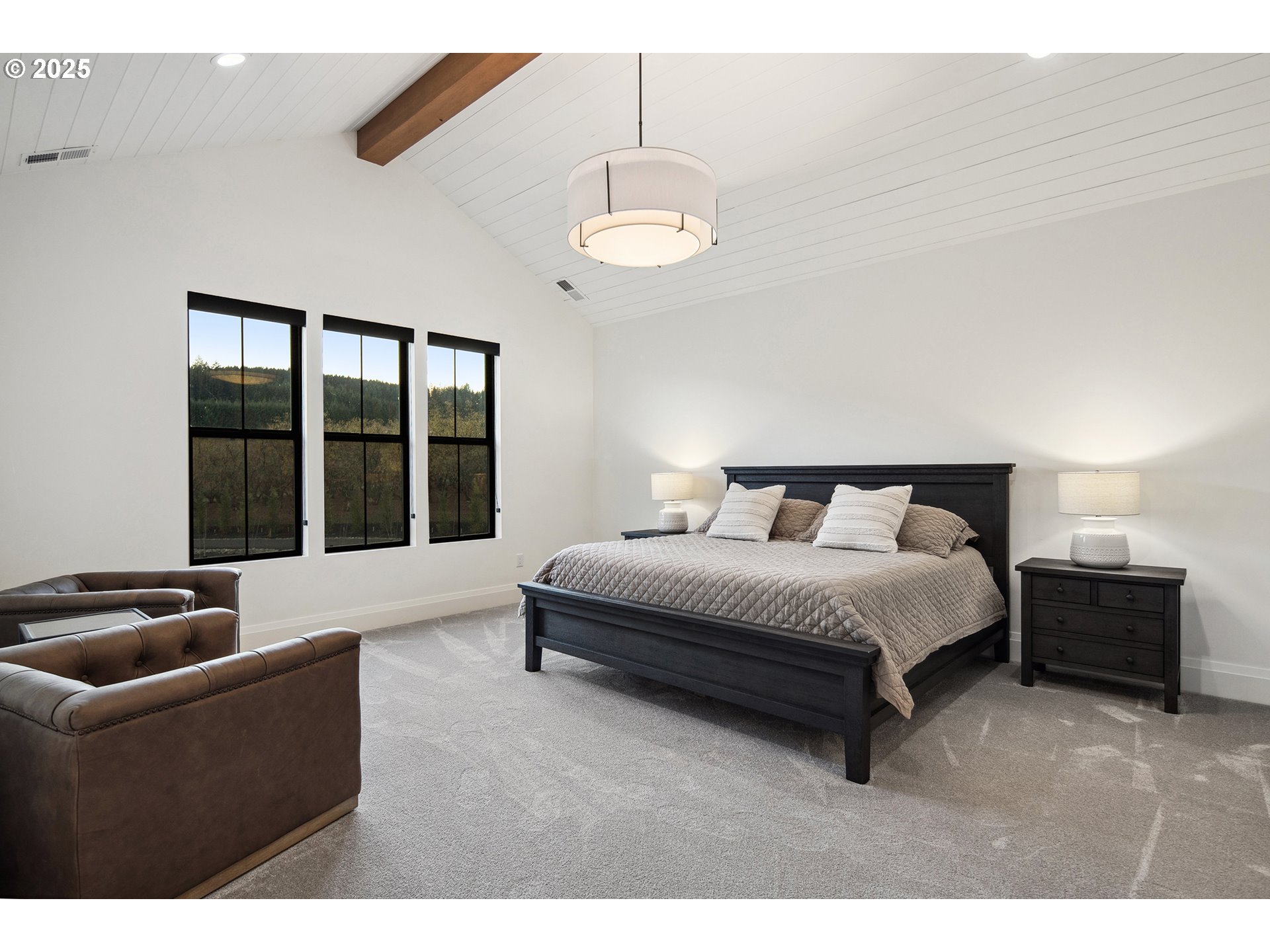 48493 Northwest Hillside Road Forest Grove, OR 97116 - Photo 37 of 48 a spacious bedroom with a bed and a couch