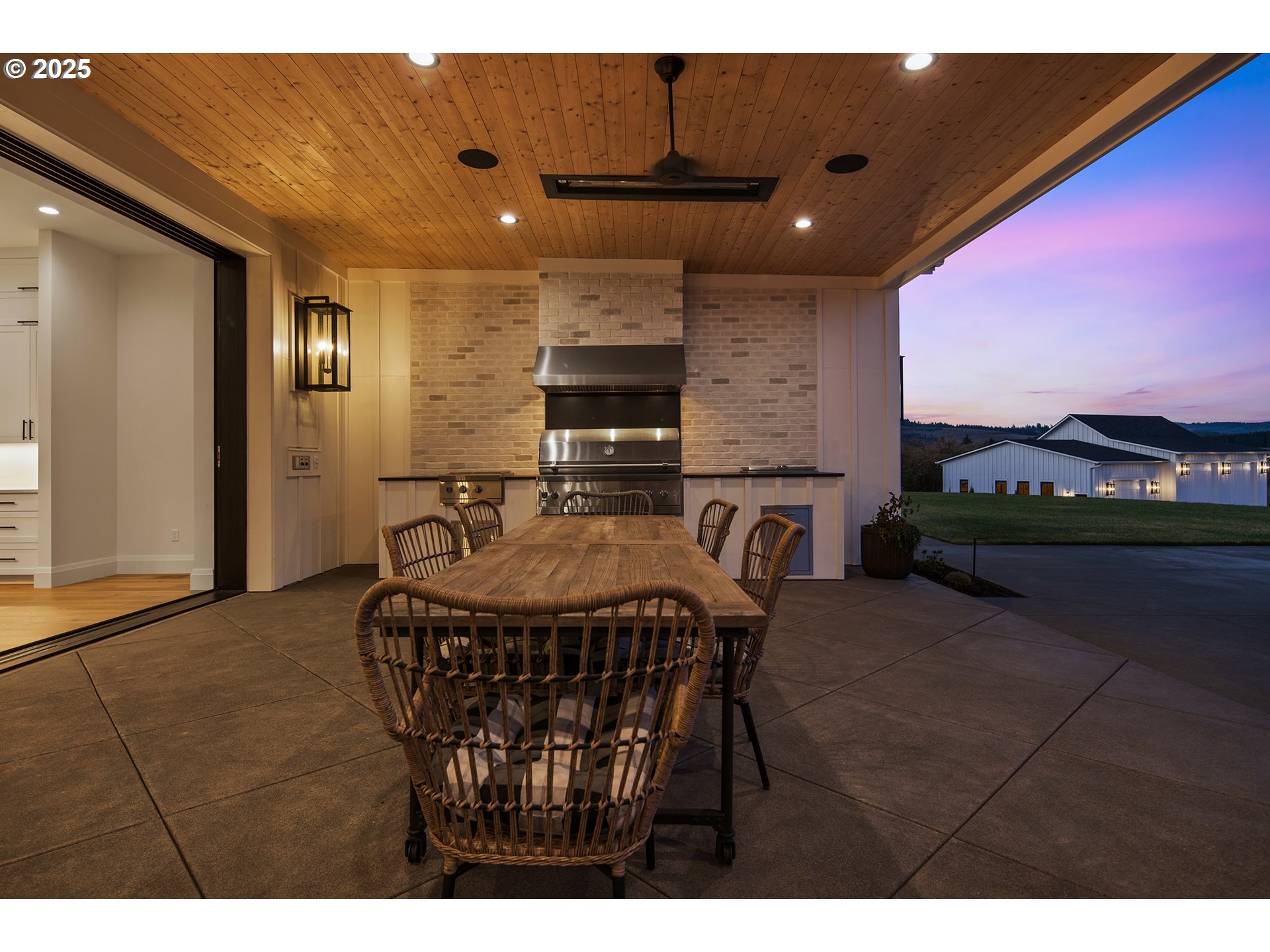 48493 Northwest Hillside Road Forest Grove, OR 97116 - Photo 42 of 48 a dining room with furniture and a flat screen tv