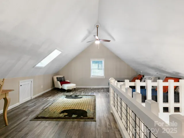 a bedroom with furniture and a wooden floor