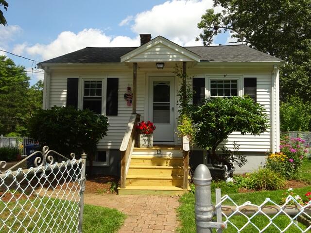 13 Old Salt Works Road Buzzards Bay, MA 02532 - Photo 1 of 49 a front view of a house with a porch