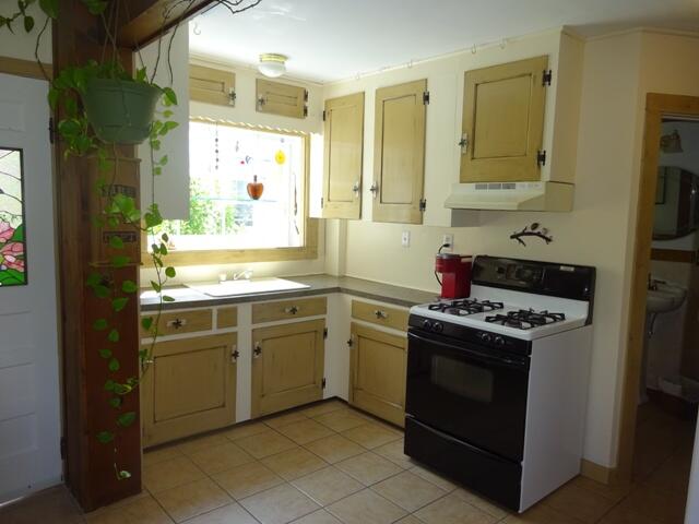 13 Old Salt Works Road Buzzards Bay, MA 02532 - Photo 11 of 49 a kitchen with a stove and a sink