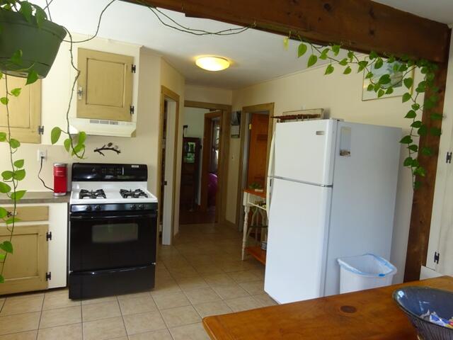13 Old Salt Works Road Buzzards Bay, MA 02532 - Photo 14 of 49 a kitchen with a refrigerator and a stove