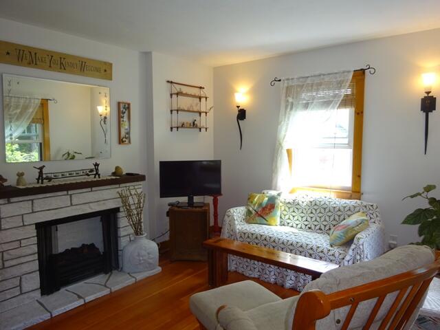 13 Old Salt Works Road Buzzards Bay, MA 02532 - Photo 21 of 49 a living room with furniture and a fireplace