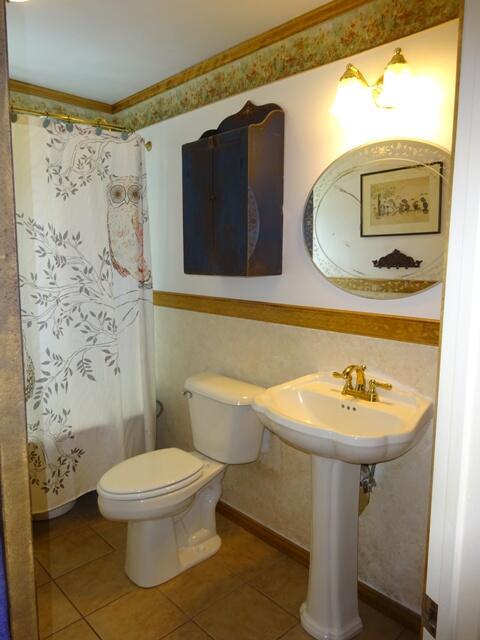 13 Old Salt Works Road Buzzards Bay, MA 02532 - Photo 28 of 49 a bathroom with a sink a mirror and a toilet