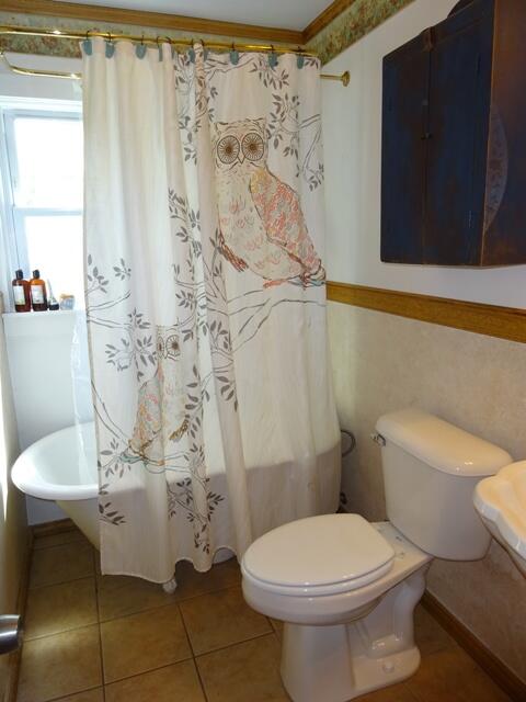 13 Old Salt Works Road Buzzards Bay, MA 02532 - Photo 29 of 49 a bathroom with a toilet and shower curtain