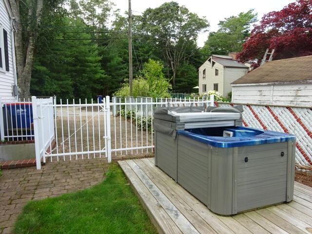 13 Old Salt Works Road Buzzards Bay, MA 02532 - Photo 35 of 49 a view of a wooden deck and a backyard