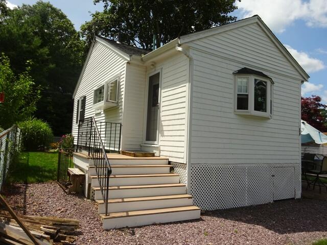 13 Old Salt Works Road Buzzards Bay, MA 02532 - Photo 41 of 49 a view of a house with a yard and sitting area