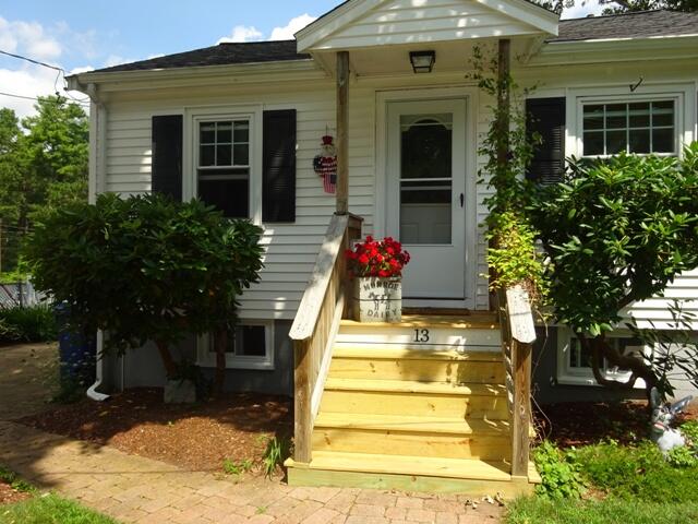 13 Old Salt Works Road Buzzards Bay, MA 02532 - Photo 5 of 49 a front view of a house with a yard