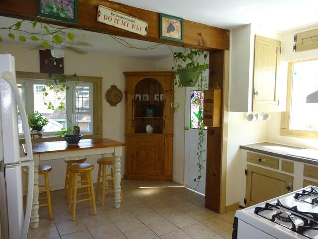 13 Old Salt Works Road Buzzards Bay, MA 02532 - Photo 10 of 49 a kitchen with a sink and chairs