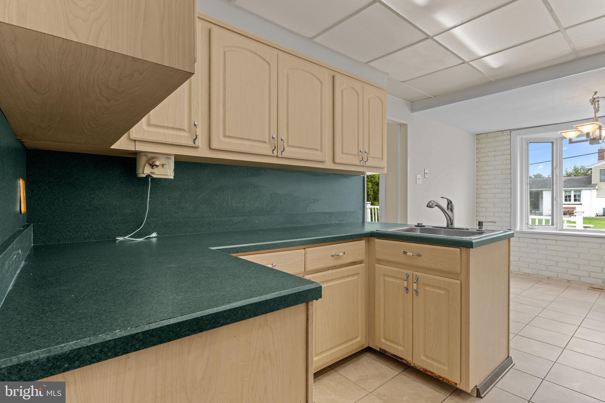 3817 Dorchester Road Philadelphia, PA 19154 - Photo 17 of 32 a kitchen with white cabinets and sink