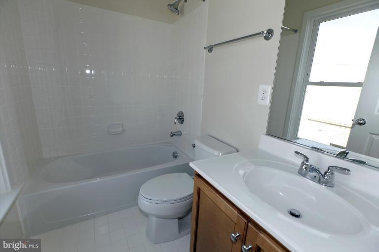 915 4th Street Southeast Washington, DC 20003 - Photo 14 of 24 a bathroom with a sink toilet and shower