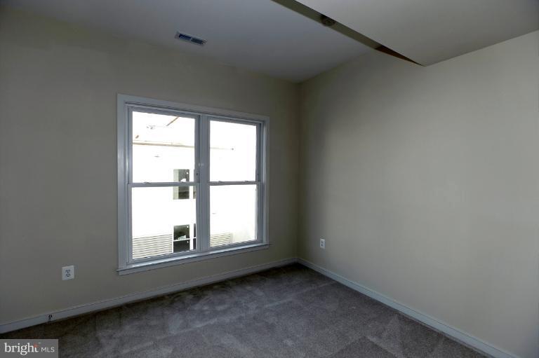 915 4th Street Southeast Washington, DC 20003 - Photo 20 of 24 an empty room with a window