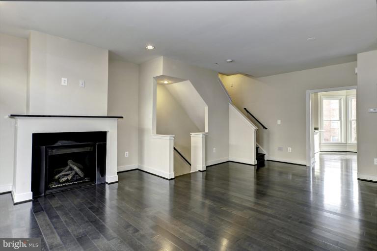 915 4th Street Southeast Washington, DC 20003 - Photo 4 of 24 a view of an empty room with wooden floor fire place