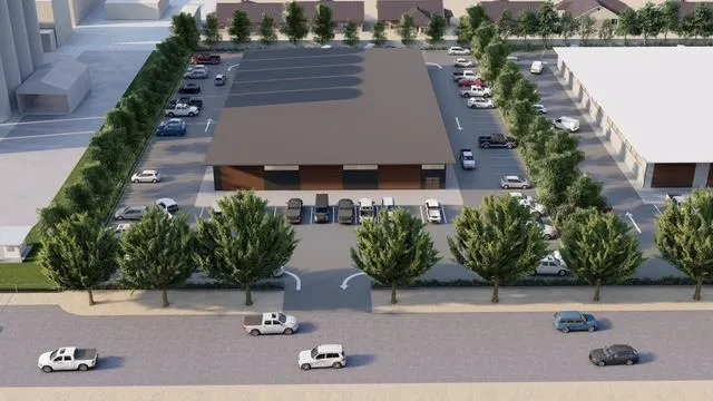 an aerial view of a house with yard and seating space