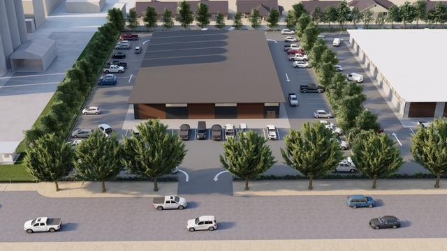 an aerial view of a house with yard and seating space