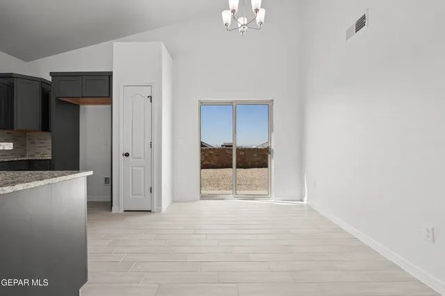 a kitchen with a sink stove and refrigerator