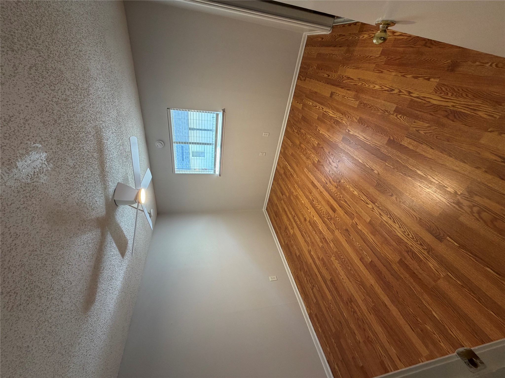 1725 Toomey Road, Unit 304 Austin, TX 78704 - Photo 9 of 11 wooden floor in an empty room