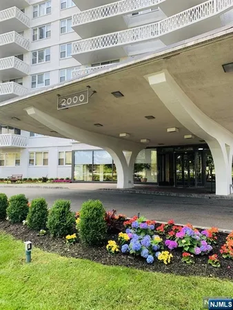 a front view of a building with garden
